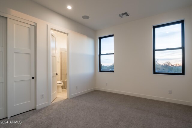 34749 N 83rd Way, Scottsdale, AZ 85266 - unfurnished bedroom featuring light carpet and ensuite bath