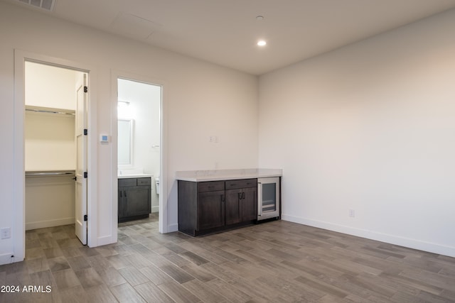 34749 N 83rd Way, Scottsdale, AZ 85266 - unfurnished bedroom with ensuite bathroom, a spacious closet, a closet, and light wood-type flooring