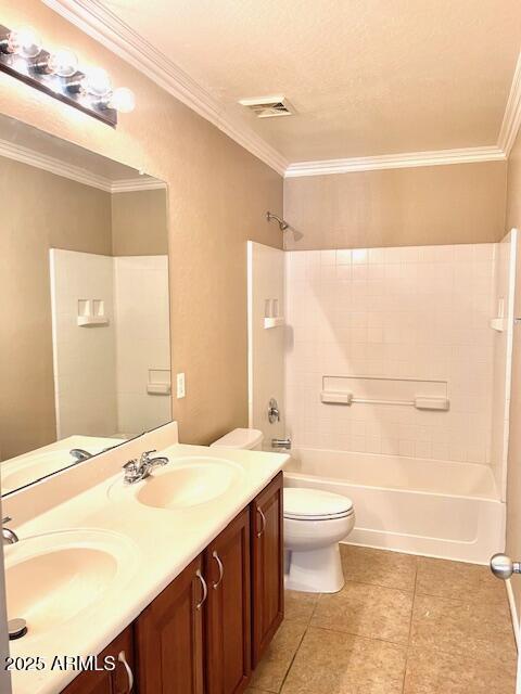 bathroom with toilet, washtub / shower combination, visible vents, and a sink