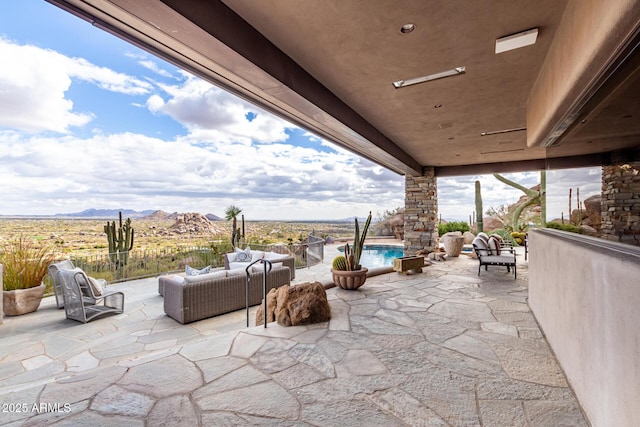 view of patio / terrace with a mountain view, an outdoor living space, and a fenced in pool