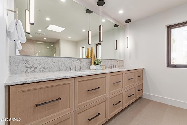 full bath featuring tasteful backsplash, visible vents, a sink, and double vanity