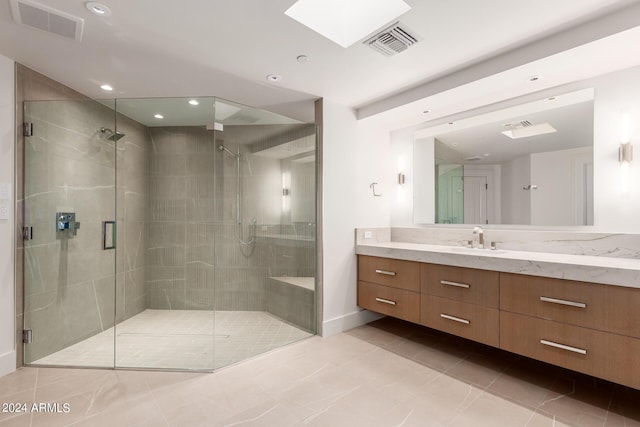 bathroom featuring visible vents, vanity, and a shower stall