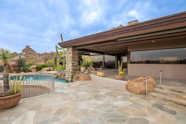 view of patio / terrace with an outdoor pool