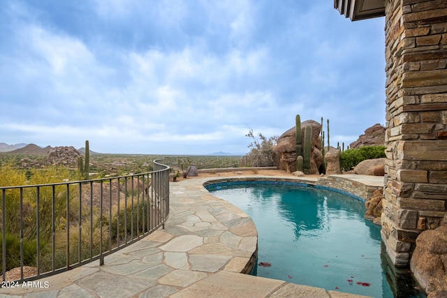 view of pool with a fenced in pool and a patio