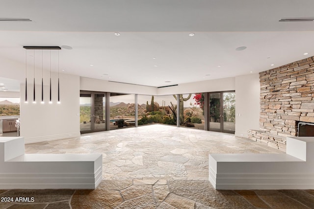 interior space featuring recessed lighting, plenty of natural light, visible vents, and french doors