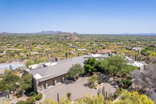 birds eye view of property featuring a mountain view