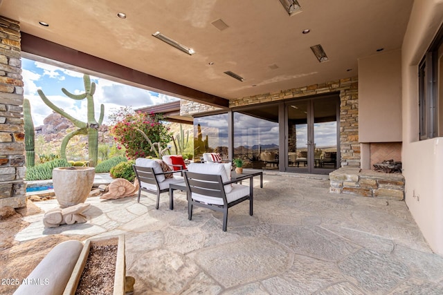 view of patio / terrace featuring french doors and an outdoor living space