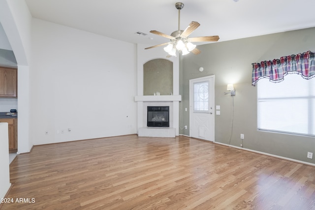 unfurnished living room featuring light hardwood / wood-style floors and ceiling fan