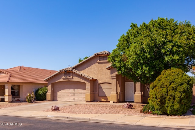 view of front of property with a garage