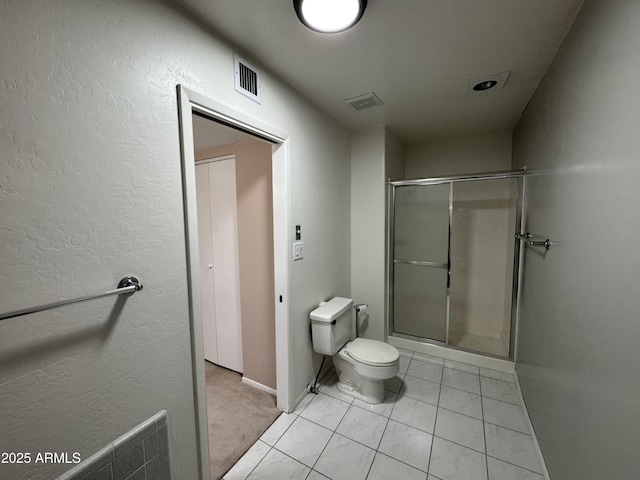 full bath featuring visible vents, a stall shower, toilet, and baseboards