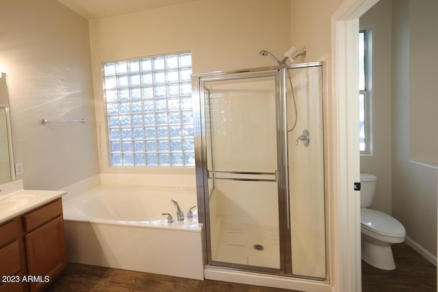 full bathroom with separate shower and tub, hardwood / wood-style floors, vanity, and toilet