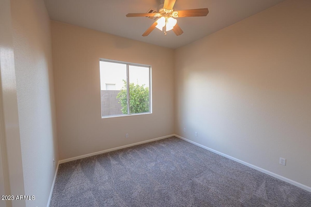 spare room with ceiling fan and carpet floors