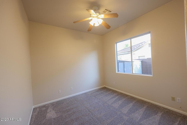 empty room with carpet flooring and ceiling fan