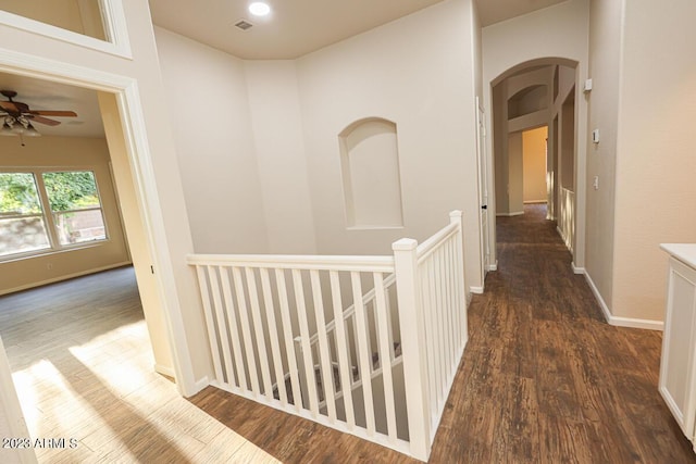 hallway with dark hardwood / wood-style flooring