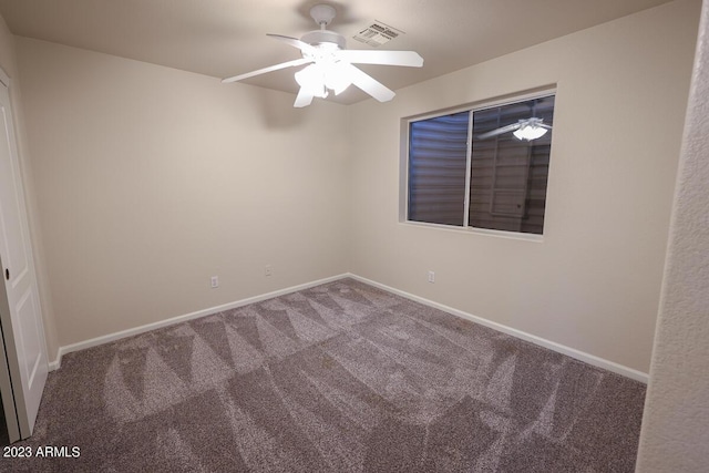 carpeted empty room with ceiling fan