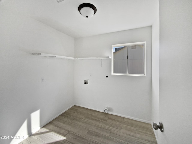 washroom featuring hardwood / wood-style flooring, electric dryer hookup, and washer hookup