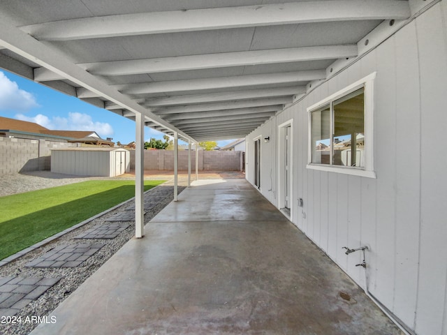 view of patio / terrace with a shed