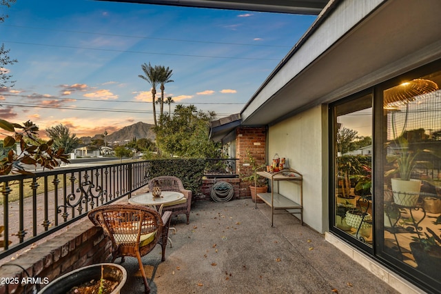 balcony at dusk with a mountain view