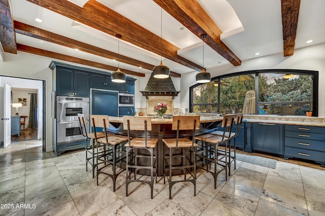 dining area with beam ceiling