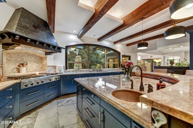 kitchen with premium range hood, backsplash, stainless steel gas cooktop, hanging light fixtures, and beamed ceiling