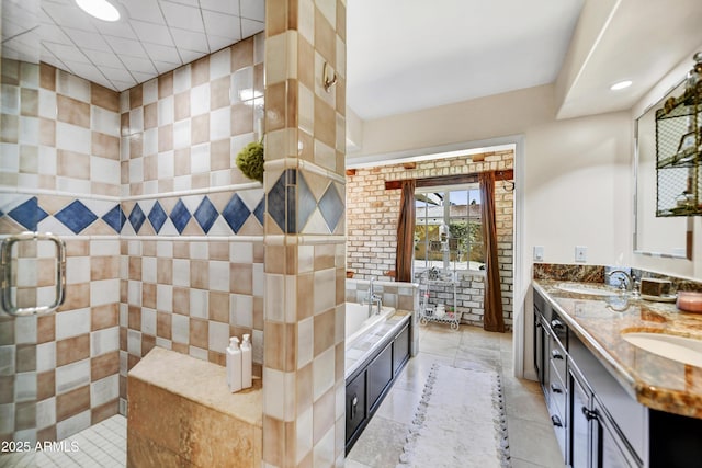 bathroom featuring independent shower and bath, tile patterned floors, and vanity