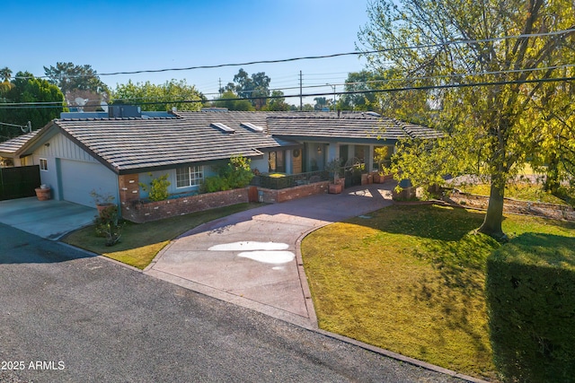 single story home with a garage and a front yard