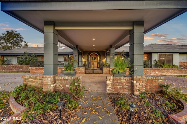 view of exterior entry at dusk