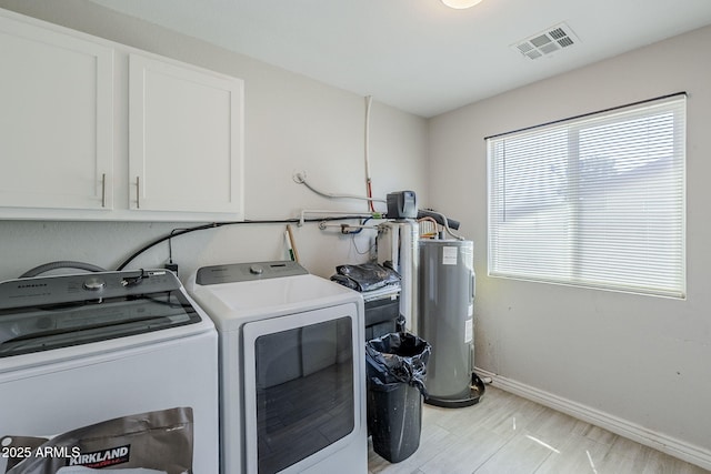 7135 W Flower St, Phoenix, AZ 85033 - laundry room with cabinet space, washer and clothes dryer, and baseboards