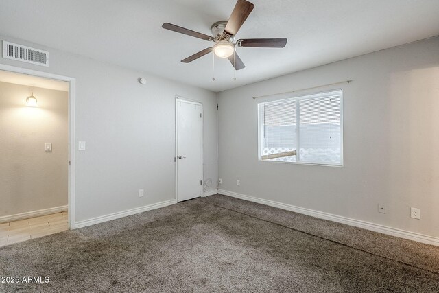 7135 W Flower St, Phoenix, AZ 85033 - spare room with carpet flooring, ceiling fan, and baseboards