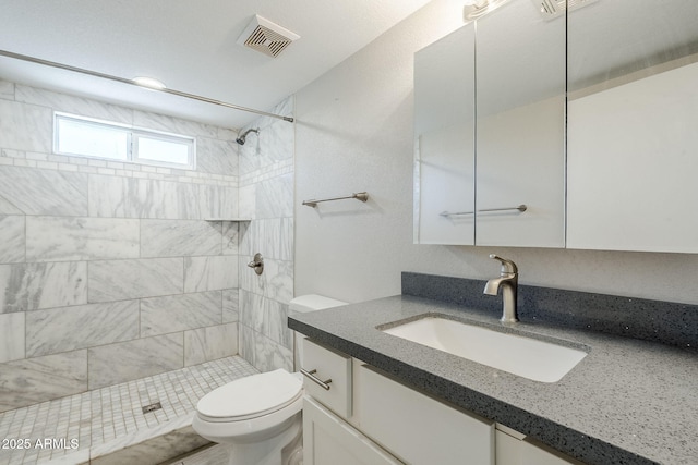 7135 W Flower St, Phoenix, AZ 85033 - full bath with vanity, toilet, and a tile shower