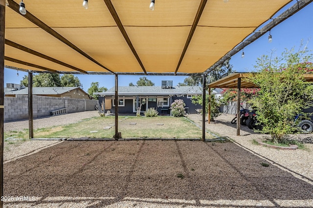7135 W Flower St, Phoenix, AZ 85033 - fenced backyard with a patio