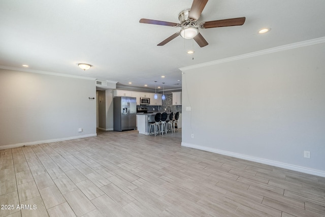7135 W Flower St, Phoenix, AZ 85033 - unfurnished living room featuring a ceiling fan, recessed lighting, ornamental molding, baseboards, and light wood-style floors