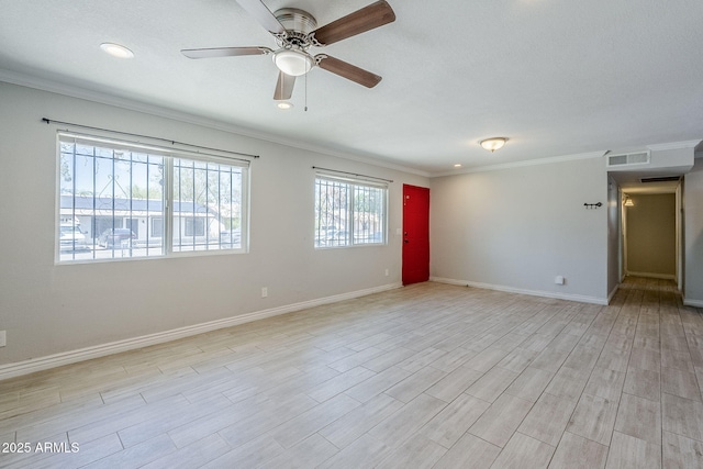 7135 W Flower St, Phoenix, AZ 85033 - spare room with ceiling fan, ornamental molding, baseboards, light wood finished floors, and recessed lighting
