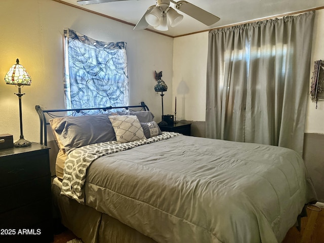 bedroom featuring ornamental molding and a ceiling fan