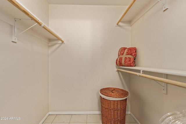 spacious closet featuring light tile patterned floors