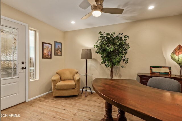 office area with light hardwood / wood-style flooring and ceiling fan