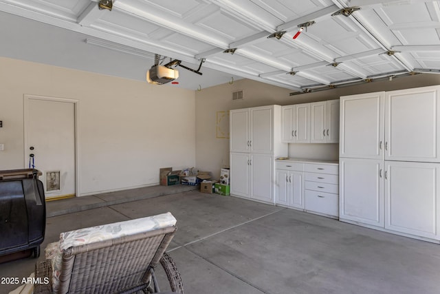 garage featuring a garage door opener