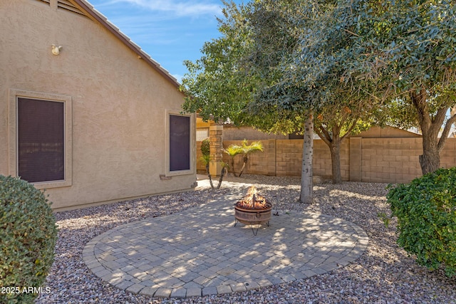 view of patio with an outdoor fire pit