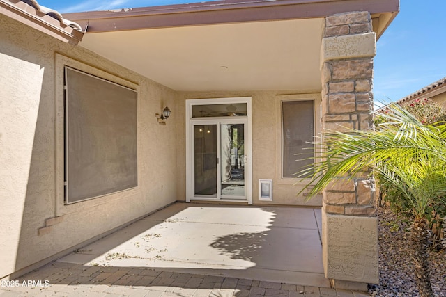 doorway to property featuring a patio