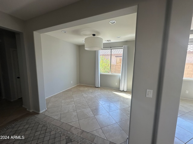 empty room with light tile patterned flooring