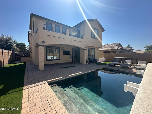 view of swimming pool with a patio area