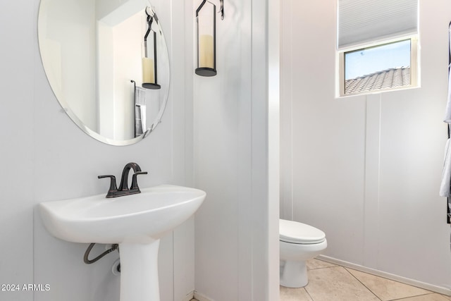 bathroom featuring tile patterned flooring and toilet