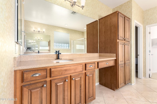 bathroom with tile patterned floors and vanity