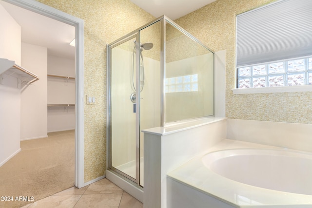 bathroom featuring tile patterned floors and plus walk in shower