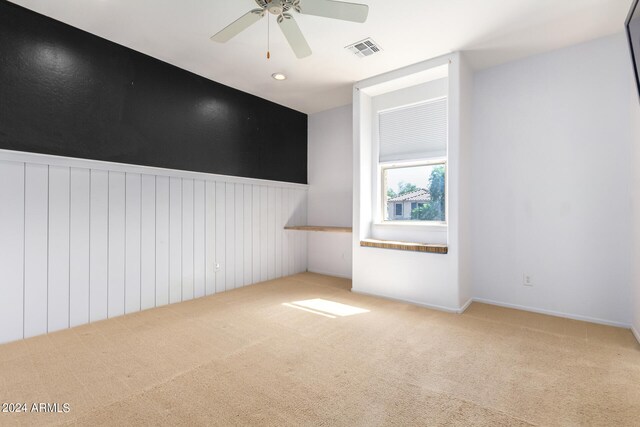 additional living space featuring ceiling fan and carpet floors