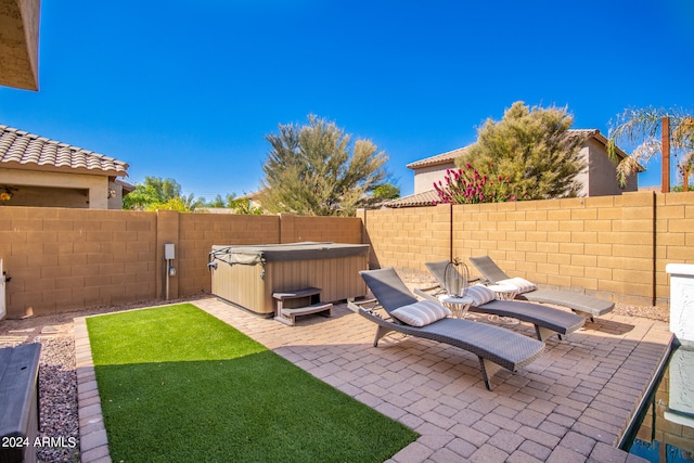 view of patio / terrace featuring a hot tub