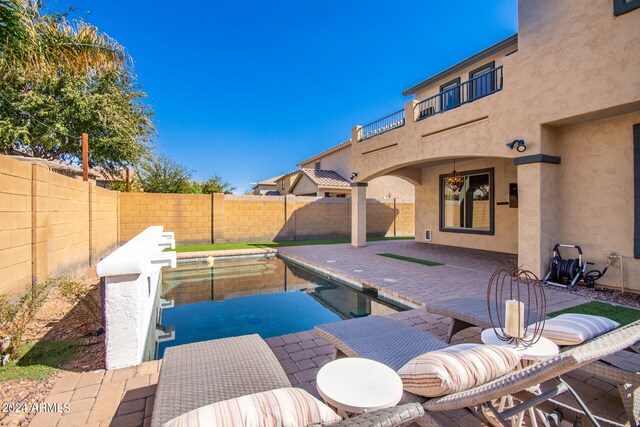 view of patio / terrace featuring a fenced in pool