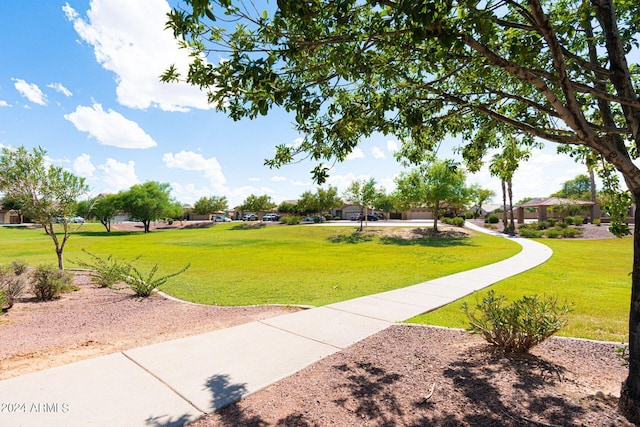 view of home's community featuring a yard