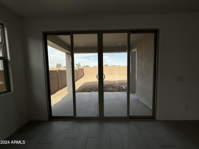 doorway to outside with wood finished floors