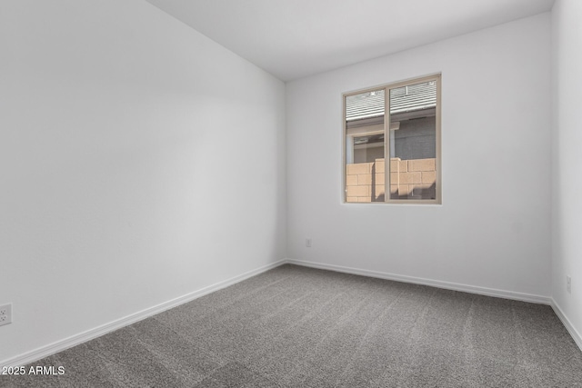 empty room with carpet flooring and baseboards
